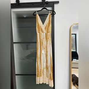 Edie and yellow summer dress, plunging neckline